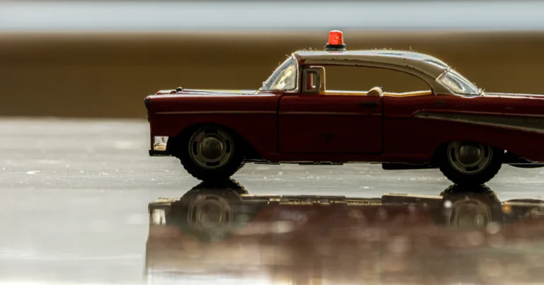 Toy car with a red siren light, for emergency alerts on iPhone