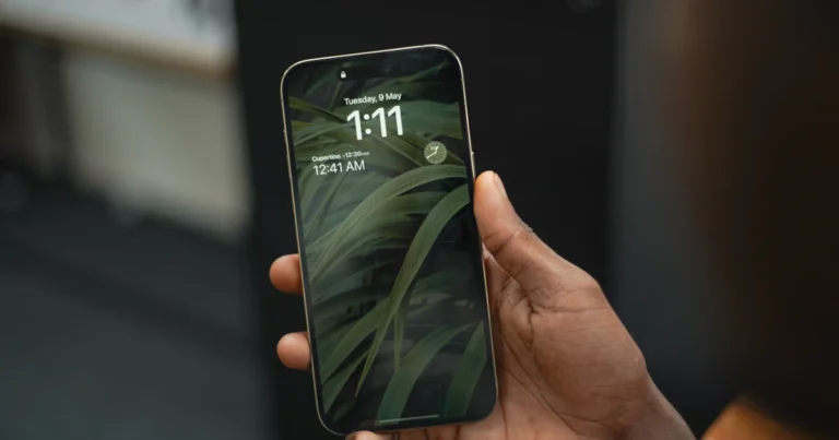 Person holding an iPhone to screen record with sound