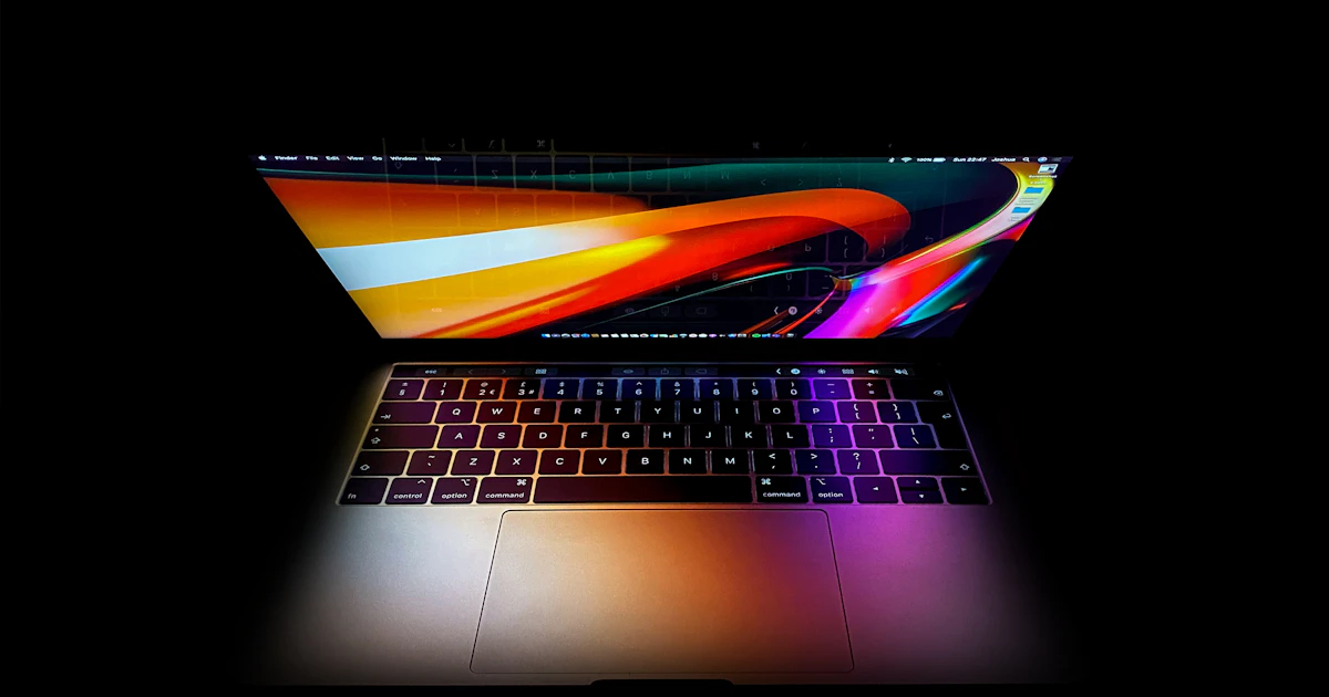 MacBook Pro with a colourful glowing screen