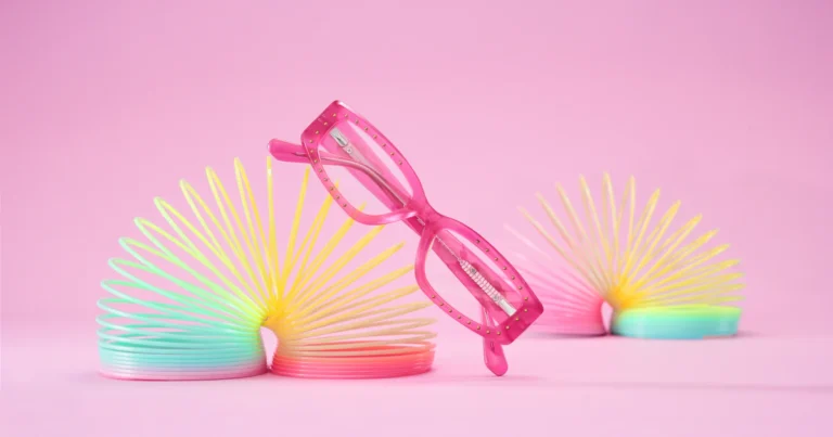 Reduce computer eye strain - pink eyeglasses on colorful toys