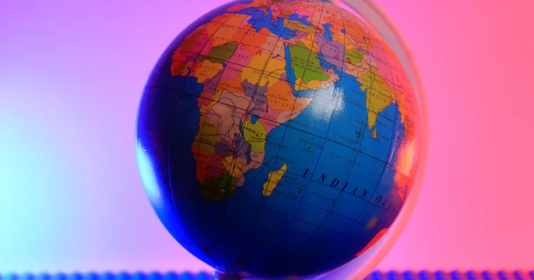 Why is my internet slow - colorful globe on a pink background